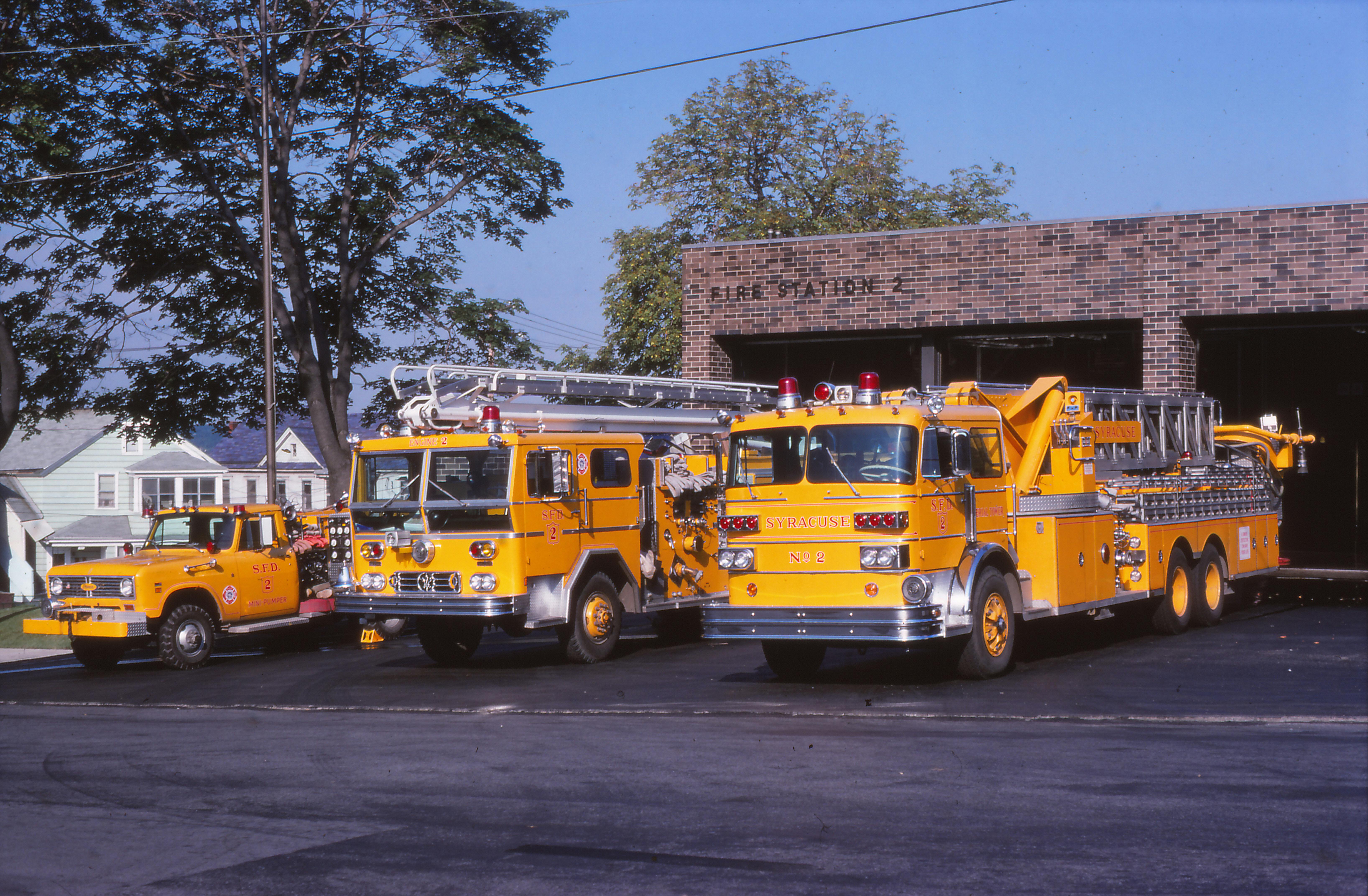 In 1977, Syracuse, NY, Fire Department (SFD) Station 2&rsquo;s apparatus were (from left to right) Mini 2 (a 1973 International Pierce), Engine 2 (a 1973 Ward LaFrance 50-foot Telesquirt) and Truck 2 (a 1973 Sutphen 85-foot aerial tower). SFD truck companies didn&rsquo;t operate as quints and carried 233 feet of ground ladders.