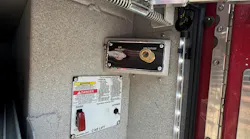 an air outlet that’s tucked inside of a compartment on a tractor-drawn aerial fire vehicle