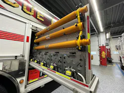 a compartment for stabilization equipment that has vertical pull-out trays on a fire department rescue vehicle