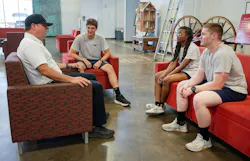 fire department chief speaking casually with department recruits