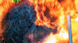 firefighters at front door of house as flashover occurs