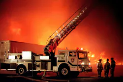 fire department aerial apparatus operating at warehouse fire