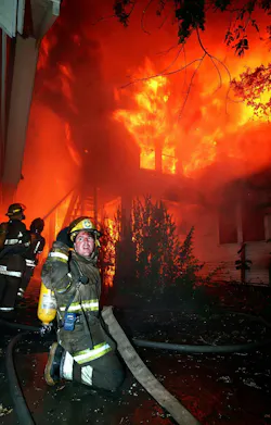 firefighter fighting a house fire