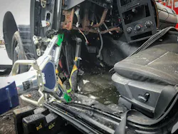 battery-powered spreader in position for vehicle extrication involving police car