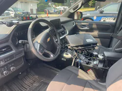 interior of front seat of police car and systems that are different than civilian automobiles