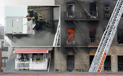 An FDNY firefighter removes a toddler from a burning Bronx building Wednesday.
