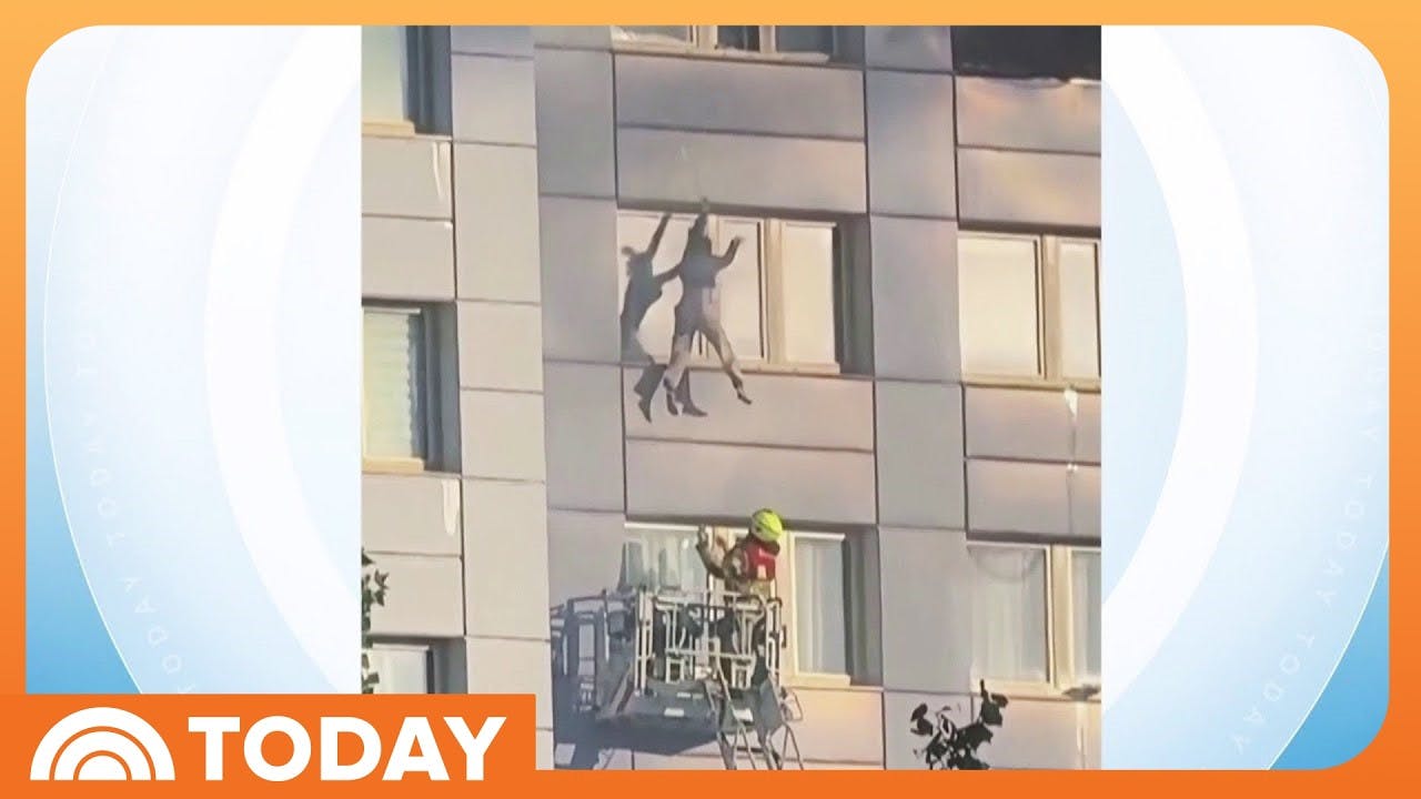 Woman Falls Into Firetruck Rescue Basket to Escape Building Fire