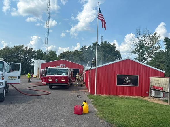 Cuba firefighters ran into the smokey station to get apparatus and equipment out.