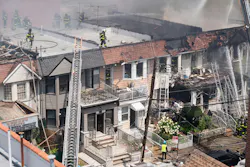 A 78-year-old woman died and 22 other people, including more than a dozen firefighters, were injured after a massive fire ripped through a Queens home on College Point Blvd. near 41st Rd. in Flushing, Queens on Saturday, July 25, 2026, before spreading to two adjoining buildings.