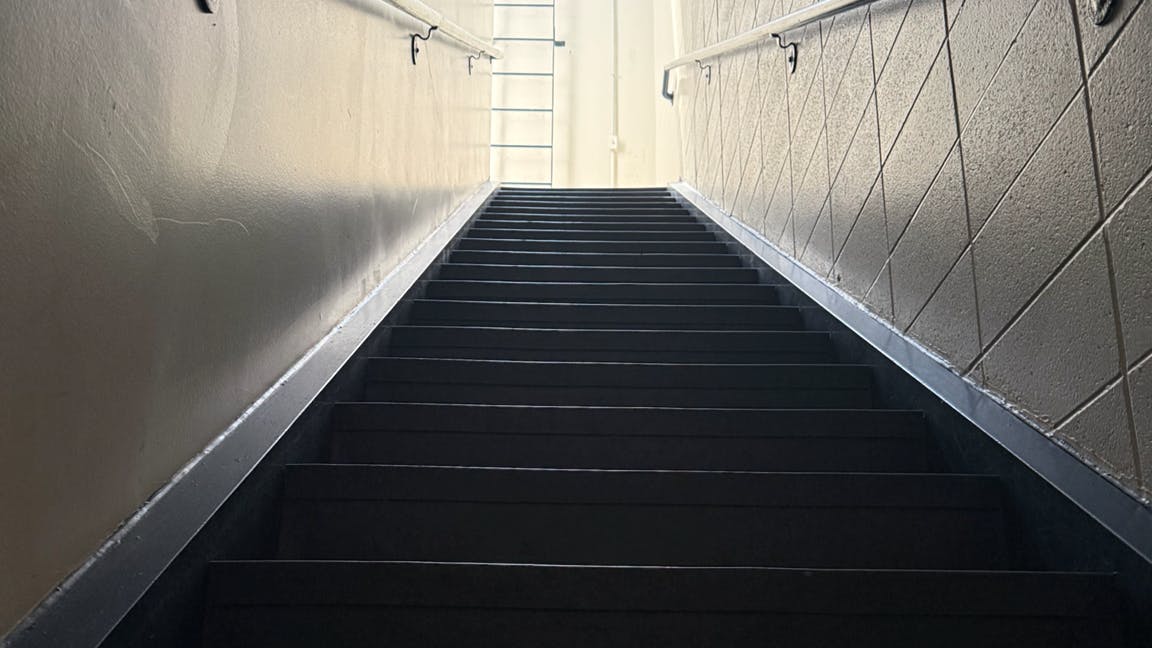stairwell leading up as symbol of roadblock to promotion for many fire department middle managers