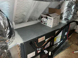 mechanical equipment and ductwork that’s located within an attic that’s insulated at the roofline with SPF