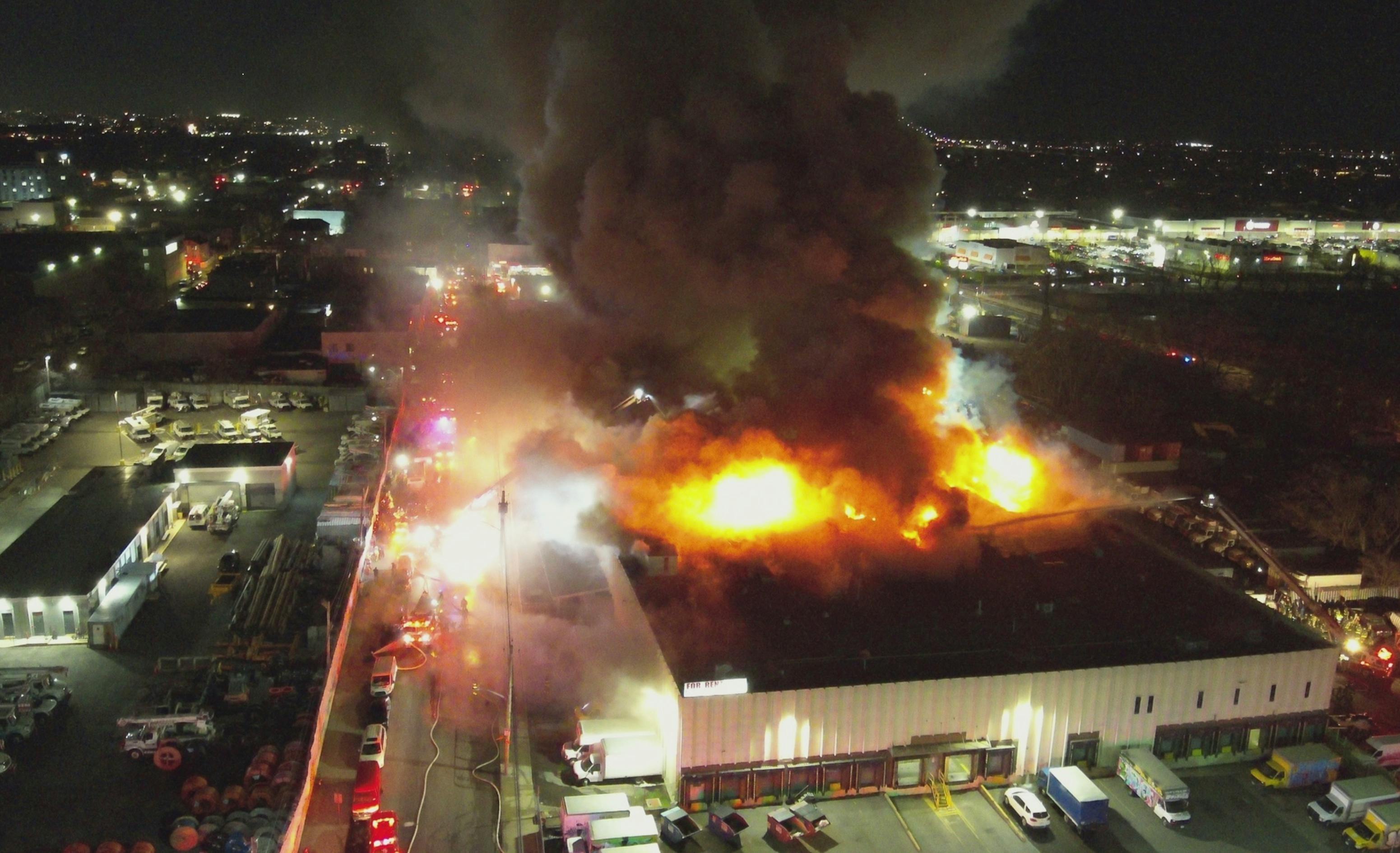 drone view of commercial building fire