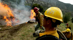 U.S. Forest Service firefighters burn forest debris in the Angeles National Forest in 2023 as part of the service's forest management practices. A new bill allows for federal firefighters to qualify for 25 percent hazard pay under when conducting prescribed burns.