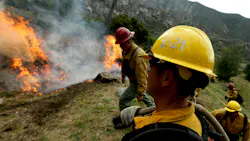 U.S. Forest Service firefighters burn forest debris in the Angeles National Forest in 2023 as part of the service's forest management practices. A new bill allows for federal firefighters to qualify for 25 percent hazard pay under when conducting prescribed burns.