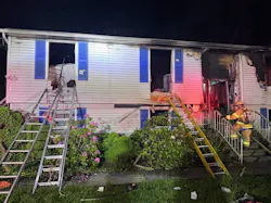 ground ladders positioned at windows of house where victims were rescue during fire