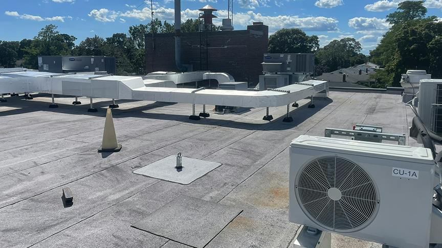 A variety of condensing units and rooftop units accommodate heating and cooling for the habitable spaces below. Insulated exterior ductwork provide HVAC where needed in this retrofit without significantly disrupting the interior spaces.