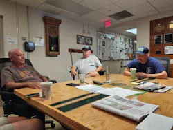 Retired Alexandria Firefighter Scott Morgan, left, talks about the 25th 9/11 anniversary ceremony at the Independent Hose Company with Mark Nelson and Eric Whitmore, also retired from Alexandria Fire Department, who was at the Pentagon.