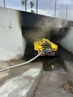Los Angeles City Fire Department firefighting robot focus large=caliber master stream of water into a tunnel