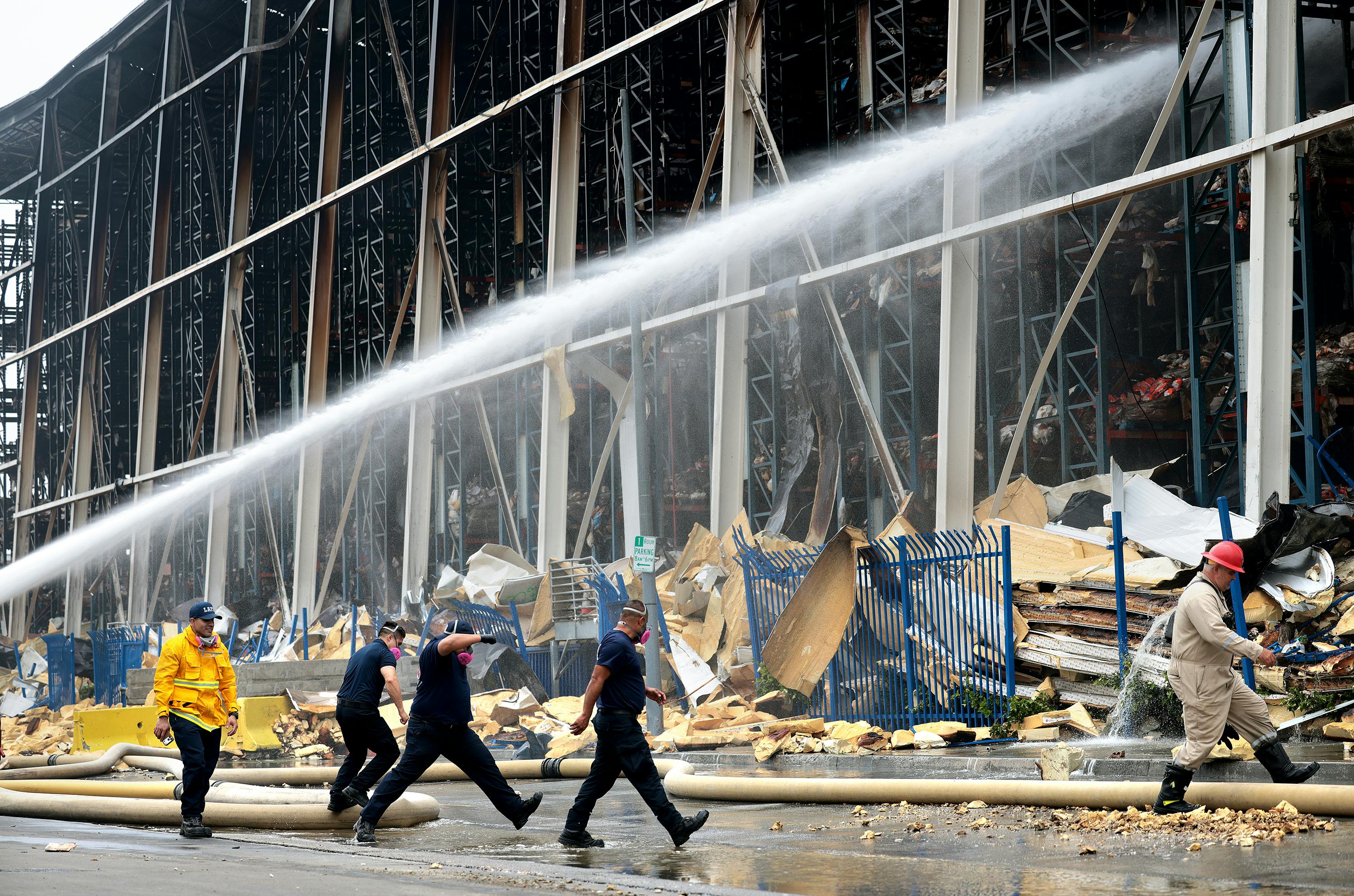 Firefighters work on the fire at the Lineage storage facility in the Boyle Heights neighborhood of Los Angeles on June 25.