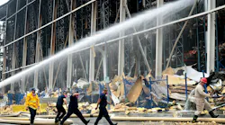Firefighters work on the fire at the Lineage storage facility in the Boyle Heights neighborhood of Los Angeles on June 25.