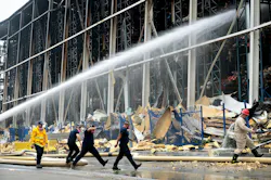 Firefighters work on the fire at the Lineage storage facility in the Boyle Heights neighborhood of Los Angeles on June 25.