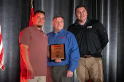 John Nieves of Round Rock, TX, who was named the 2026 Emergency Vehicle Technican of the Year (left to right) Firehouse Editor-in-Chief Peter Matthews and Ransom Hall, director of inside sales for Spartan Emergency Group/
