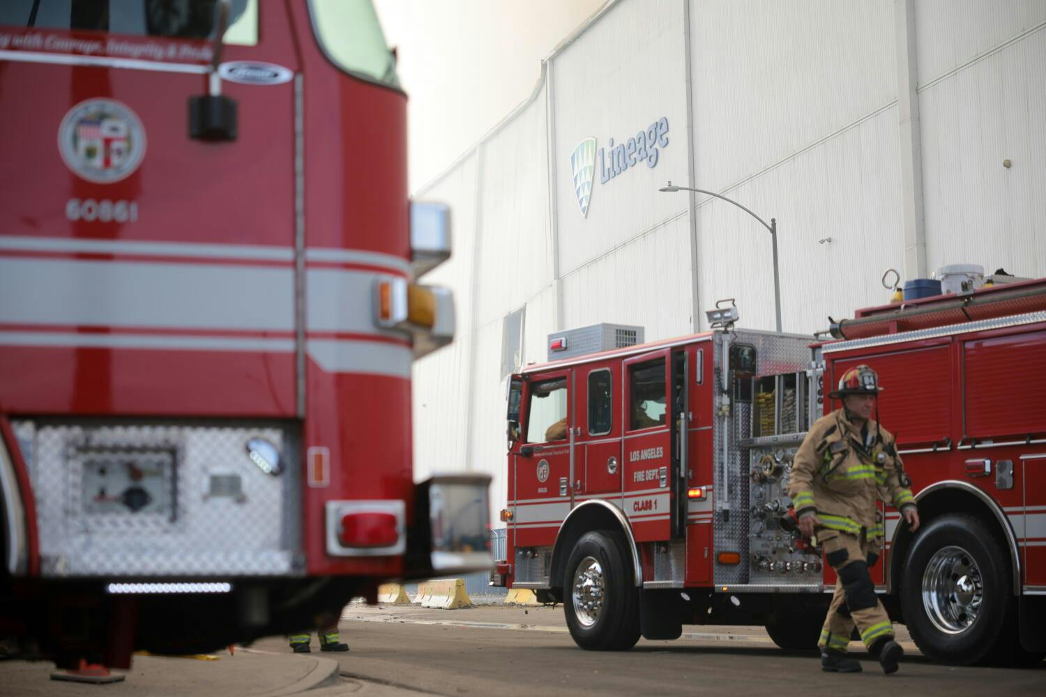 A Los Angeles Fire Department rig sits at a recent warehouse fire.
