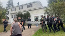 Oswego firefighters and police officers carried a ladder at the request of the U.S. Customs and Border Patrol after two men scurried to the roof during a recent encounter.