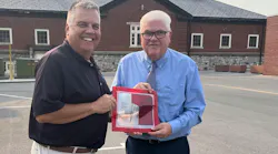 Author Mark Brady (right) donates the 'Brady Firefighting Series' to National Fire Academy Superintendent Eriks Gabliks.