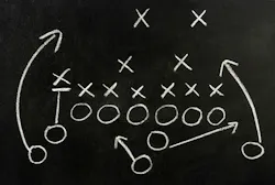 A fire department's community risk reduction playbook can be shared between fire departments, unlike a football team's guide, which could give away their competitive edge.
